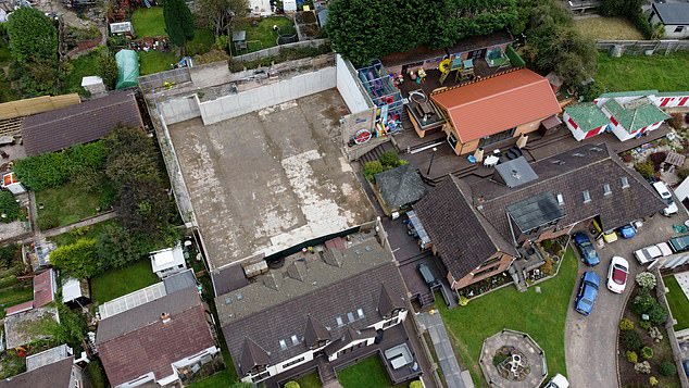 Photos show the flat area where the 10,000 square meter leisure complex once stood in the garden of Graham Wildin, who repeatedly defied court orders to demolish it