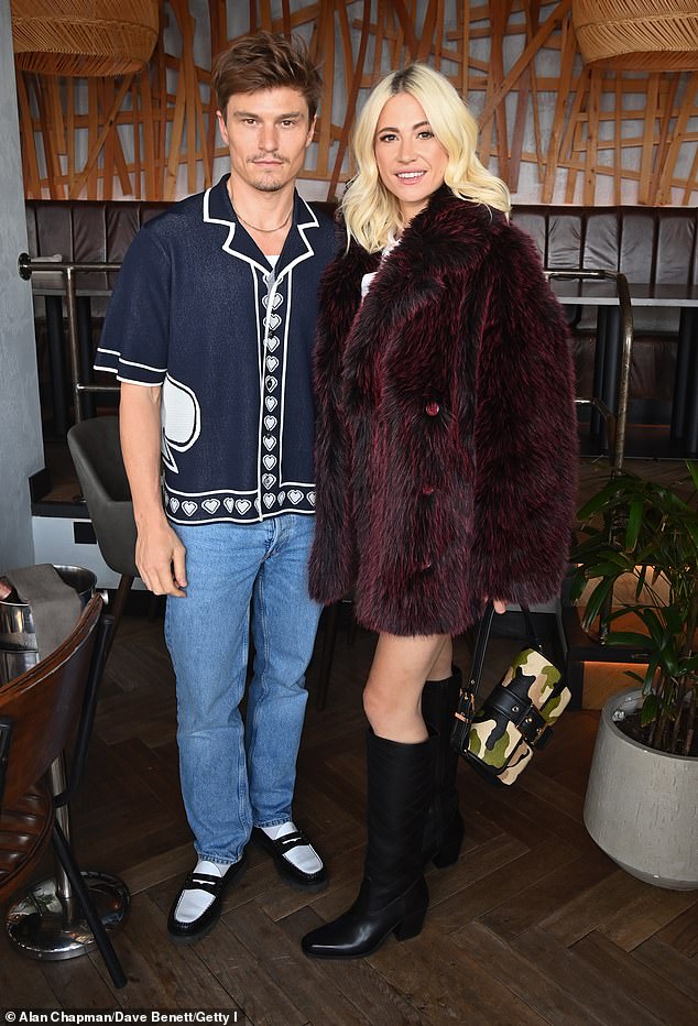 Pixie Lott looked happier than ever as she arrived at her album launch party at Treehouse restaurant in London with husband Oliver Cheshire on Wednesday.