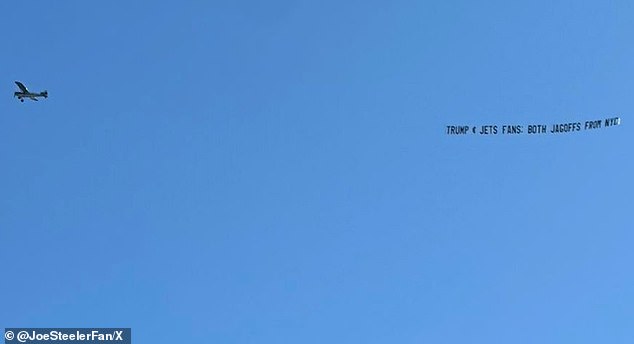 A plane flying through a cloudless sky in Pittsburgh on Sunday afternoon could be seen flying a provocative banner aimed at Donald Trump and New York Jets fans.