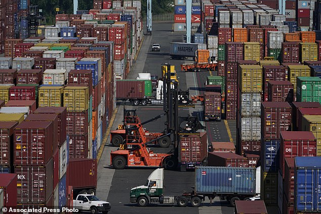 FILE - Containers are moved at the Port of New York and New Jersey in Elizabeth, NJ on June 30, 2021. (AP Photo/Seth Wenig, File)