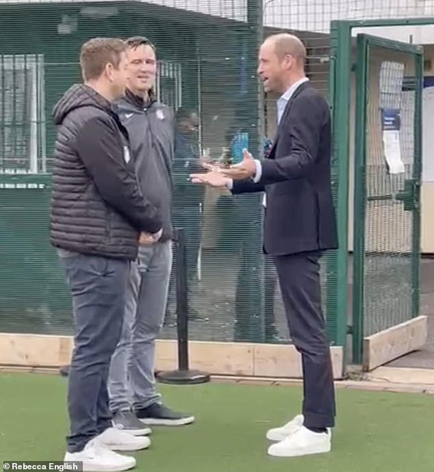 Prince William was spotted wearing a very cheerful pair of trainers with his suit as he visited the NFL Foundation in London on Tuesday