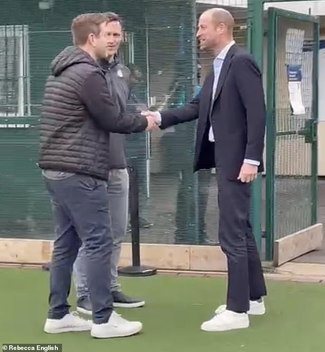 William appeared cheerful as he shook hands with representatives from NFL UK