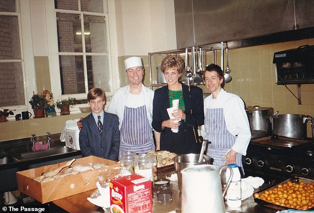 He also looked cheerful after helping with Christmas dinner and posing for a photo alongside the shelter's chefs