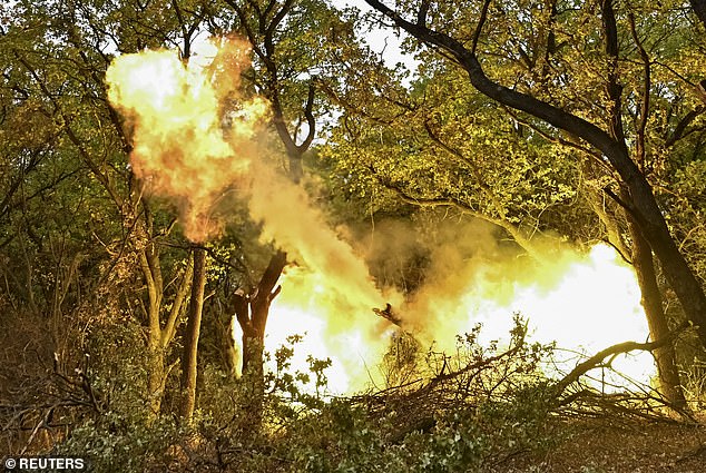 Ukrainian service members from the special police unit Hyzhak (Predator) fire a howitzer D30 towards Russian troops, amid Russia's attack on Ukraine, near the frontline city of Toretsk, Ukraine October 25, 2024