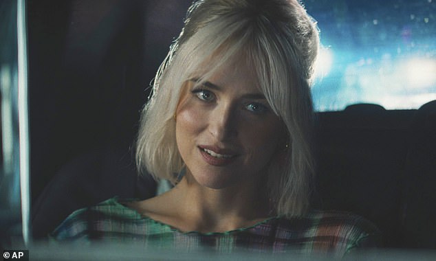 Passengers on a Qantas flight from Sydney to Tokyo got more than they bargained for when a steamy adult film was shown on every screen. Pictured is Dakota Johnson in a scene from the R-rated film Daddio