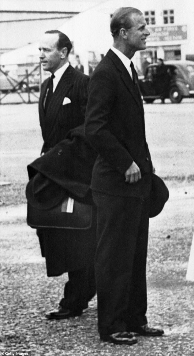 Prince Philip, right, with his private secretary, Lieutenant Commander Michael Parker in Gibraltar in 1957