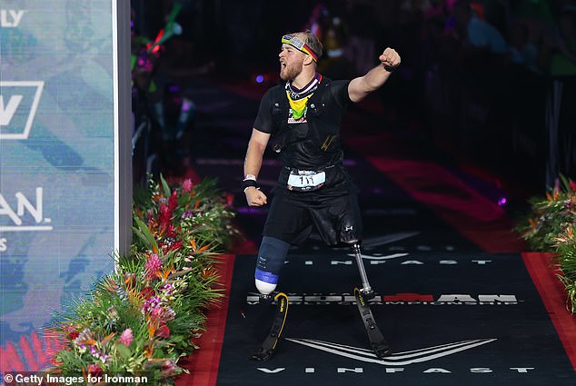 Billy Monger is pictured in the seconds after smashing the Ironman record for a double amputee at the World Championships in Hawaii