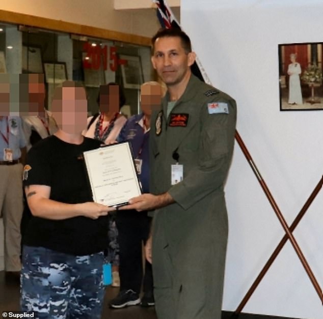 Robert Crawford, 47, is pictured presenting an award at an ADF event