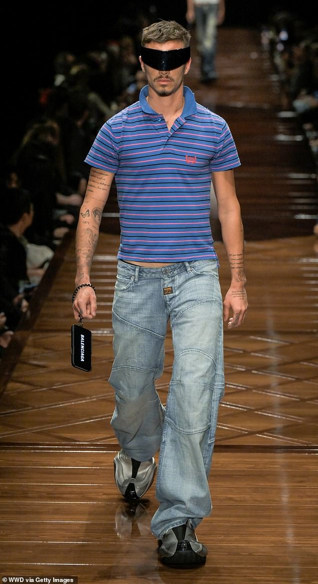 Romeo hit the Paris Fashion Week catwalk for the Balenciaga show on Monday wearing baggy jeans, a striped polo top, a pair of oversized silver moon boots and visor style sunglasses