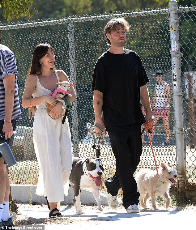 Scout LaRue Willis joined a mystery male friend to walk their dogs side by side in Los Angeles on Sunday