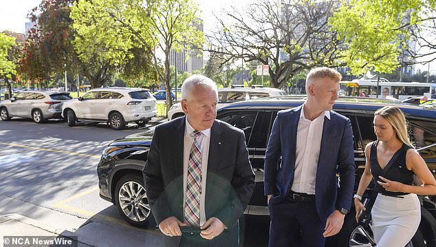 SA Police Commissioner Grant Stevens arrives at court with his family on Thursday