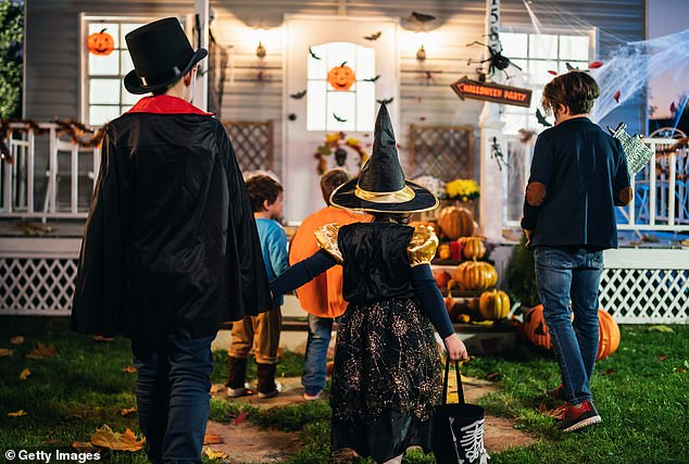 Trick or treaters approached a house on Halloween (stock image)