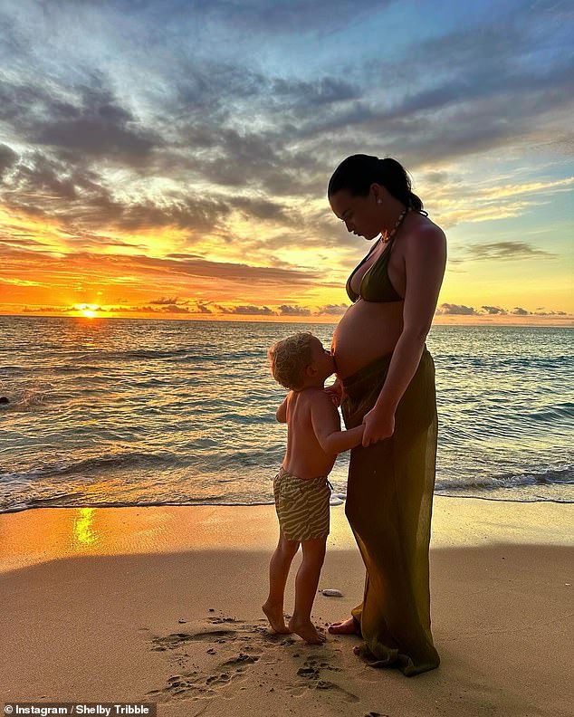 Shelby Tribble showed off her blossoming baby bump in a gorgeous new sunset beach photo with her 23-month-old son Abel on Tuesday