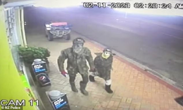 Pictured: CCTV footage of two thieves outside the ANZ bank in Te Kuiti. Police believe the person on the left is Tom Phillips and the other is one of his children