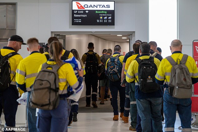 A FIFO employee earning $130,000 a year has been fired after drunkenly sexually harassing two male colleagues in a Qantas airport lounge and during a flight (stock image)