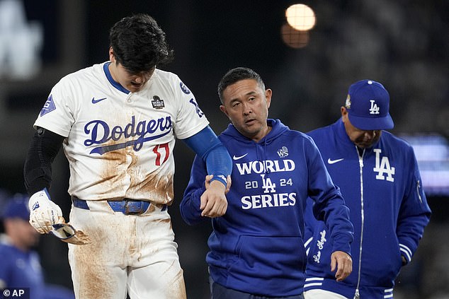 Ohtani Ohtani is helped off the field after being injured in the seventh inning of Game 2