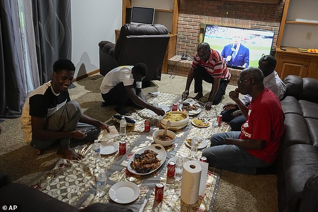 A new wave of migration from Mauritania to the US was made possible by the discovery this year of a new route through Nicaragua, which has relaxed entry requirements. Pictured: Mauritanians gather for a traditional meal, Friday, July 21, 2023, in Cincinnati