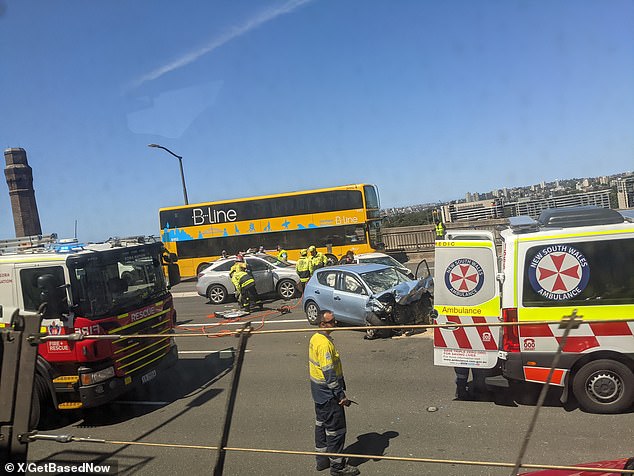 All lanes are closed in both directions on the Sydney Harbor Bridge while emergency services attend a multi-vehicle crash on the deck of the bridge.