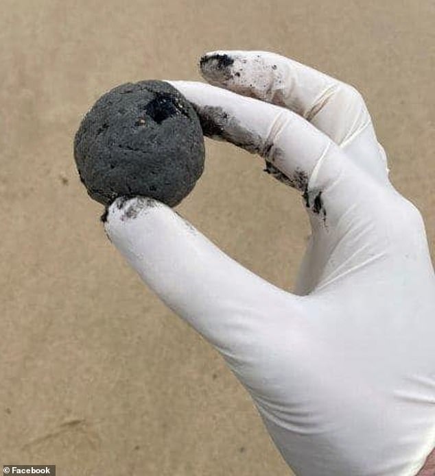 Lifeguards discovered black, ball-shaped debris washed up along Coogee Beach on Tuesday afternoon