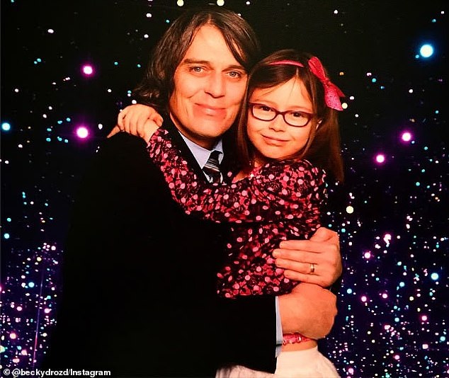 Charlotte "Bowie" Drozd is seen with her father Steven Drozd in a photo when she was 8