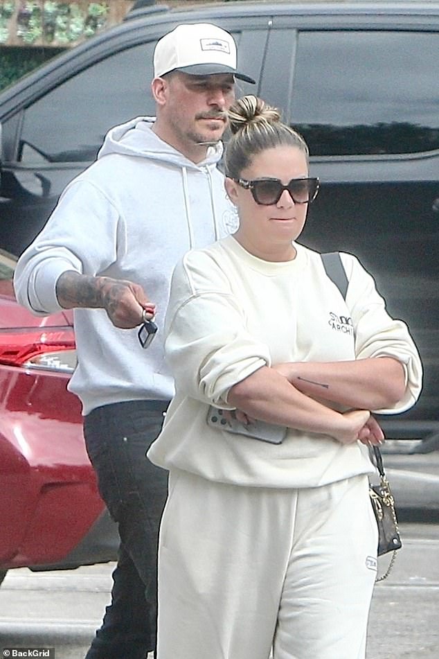 Brittany Cartwright looked tense as she walked away from Jax Taylor as the estranged couple was seen together for the first time since he filed for divorce.