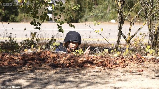 Williamson could be seen delivering her report from the ground while surrounded by bushes as the explosions erupted in the distance