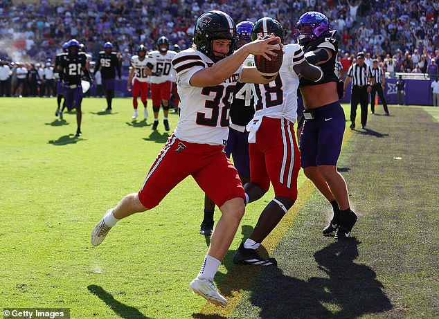 Place kicker Reese Burkhardt scores a touchdown for Texas Tech on a trick play against TCU