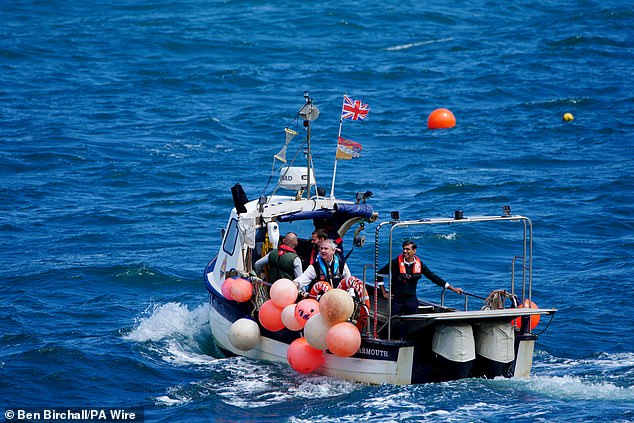 Then Prime Minister Rishi Sunak on a boat during a visit to North Devon as he headed to the election campaign. Date of photo: Tuesday, June 18, 2024