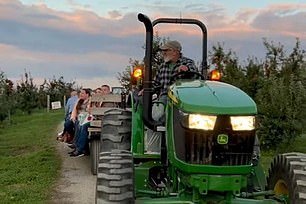 Visitors to Beak and Skiff Apple Orchards must travel by wagon to enter the farm