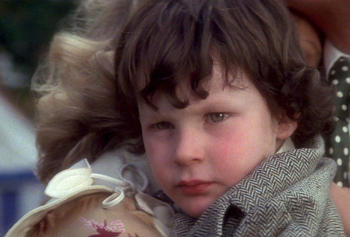 The Omen: Kid Damian stares at some people