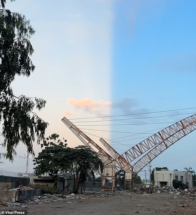 This is the bizarre moment the sky appeared to split between light and dark, leaving locals stunned