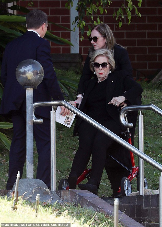 Media titan Ita Buttrose arrived through a back entrance in a lightweight red wheelchair