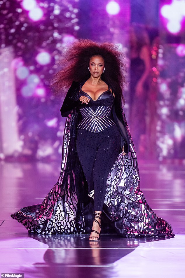 Tyra Banks, 50, made a comeback 19 years after her last US appearance, wearing black crystal-studded leggings, a black and silver bustier and a metallic cape