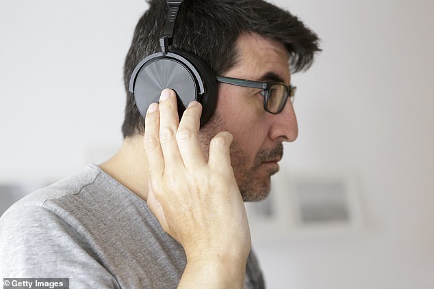 Researchers say the average pair of headphones harbors four times more bacteria than a toilet seat, while some particularly dirty headphones harbor seven times more germs (stock image)