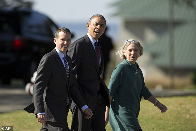 President Barack Obama, accompanied by adviser Anita Dunn, right, and senior White House adviser David Plouffe in 2012