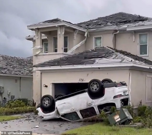 A tornado landed a car on the lawn of a house in Avenir