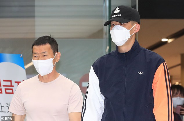 Son Woong-jung (left) and Son Heung-min (right) pictured at Gimpo Int'l Airport in 2020