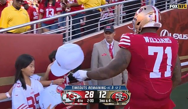 Williams autographed a young fan's hat moments after being ejected from Sunday's game