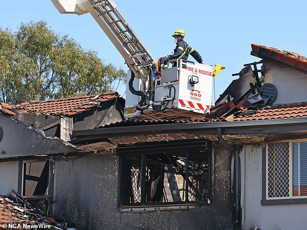 A family friend was living in the garage at the time of the fire, but had left briefly to go to the shops. When he got home, he saw that the mansion (photo) was on fire.