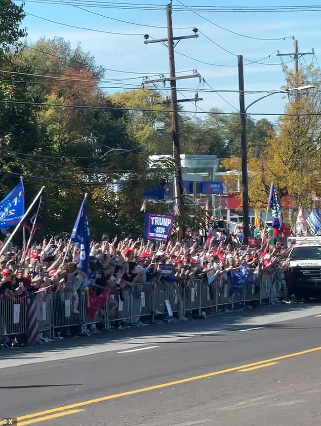 Dozens of Trump fans came out in force to watch the former president get greasy