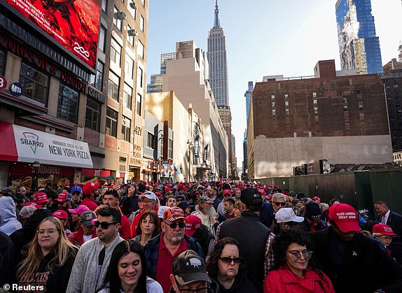 People gather outside Madison Square Garden on the day of a rally for Republican presidential candidate and former US President Donald Trump, in New York, US, October 27, 2024. REUTERS/David Dee Delgado