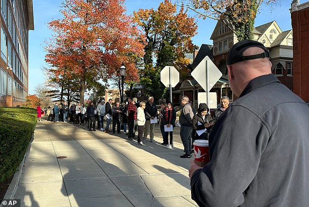 People wait in line outside the Bucks County Government Building to request an on-demand ballot on the last day to request one in Doylestown, Pennsylvania, Tuesday, October 29, 2024