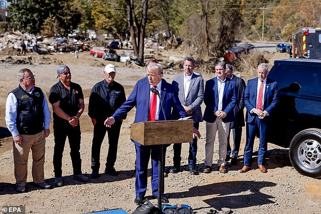 Former president and Republican presidential candidate Donald Trump comments on relief efforts with local leaders during a tour of the devastating Hurricane Helene in Swannanoa, North Carolina, October 21, 2024.