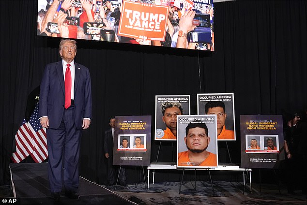 Republican presidential candidate, former President Donald Trump, arrives for a campaign rally at the Gaylord Rockies Resort & Convention Center, Friday, Oct. 11, 2024, in Aurora, Colorado. Mugshots of TDA gang members were used as stage props