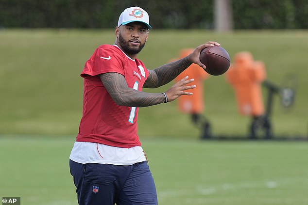 Miami Dolphins quarterback Tua Tagovailoa (1) aims the ball during Wednesday's practice