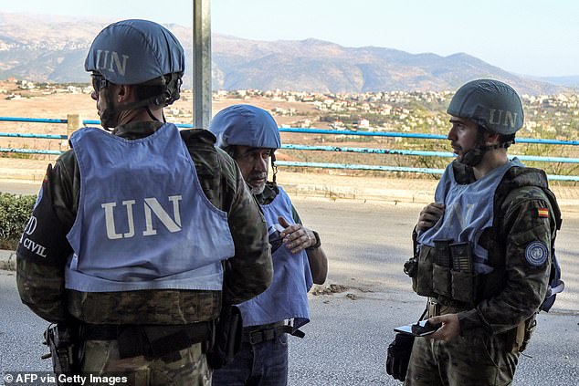 Spanish peacekeepers from the United Nations Interim Force in Lebanon (UNIFIL) coordinate their patrol with the Lebanese Military Police in Marjayoun in southern Lebanon on October 8, 2024