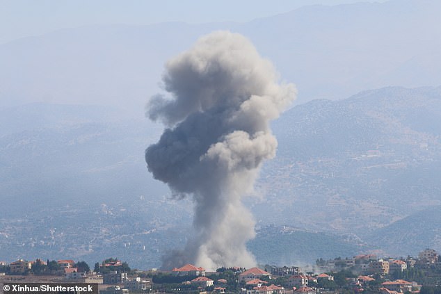 Smoke rises after an Israeli airstrike in the city of Khiyam, southeastern Lebanon