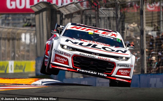 The PremiAir Supercars team (pictured at a race on the Gold Coast) have offered a $1000 reward for information about the thief who stole a steering wheel from one of their cars