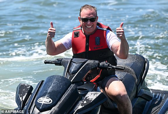 Queensland Premier Steven Miles is seen riding a jet ski at the Gold Coast Broadwater in Southport on the Gold Coast, Friday, October 25, 2024. The Queensland election will be held on October 26. (AAP Image/Darren England) NO ARCHIVING