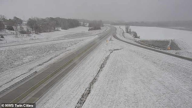 Minnesota's Twin Cities are blanketed with snowfall as heavier snow is expected later Thursday